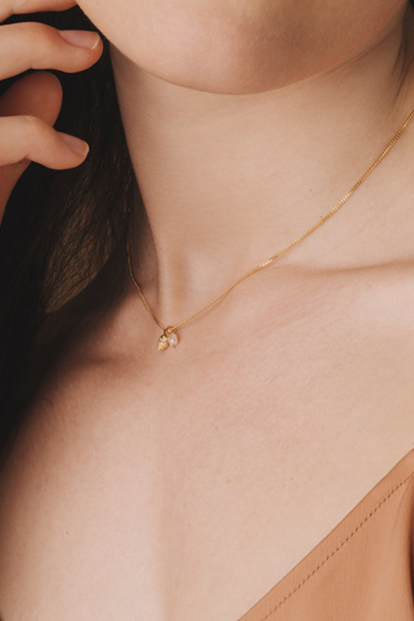 Conch shell with pearl bracelet, vermeil